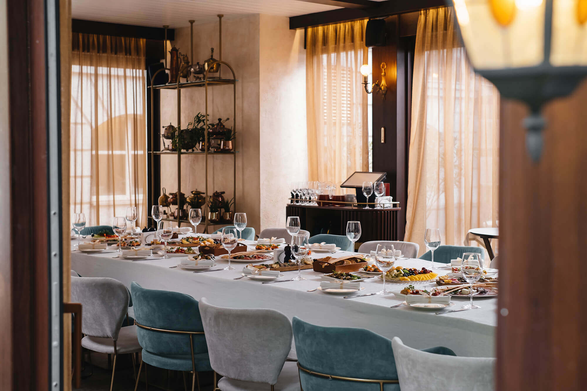 glasses-and-plates-on-long-table-in-restaurant-for-2023-11-27-05-03-45-utc-1.jpg