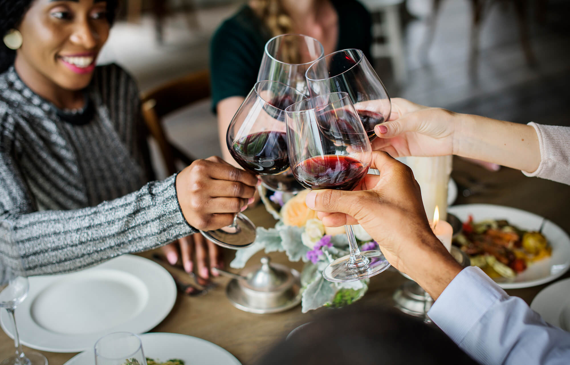 people-clinging-wine-glasses-together-in-restauran-2023-11-27-05-19-55-utc.jpg